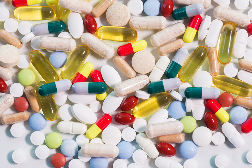 A pile of brightly colored pills. Village Apothecary Pharmacy in Woodstock, New York has a takeback dropbox for unused, unwanted, or expired medicine.